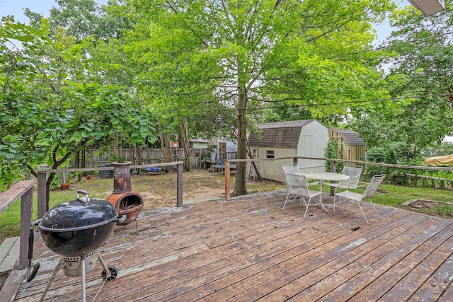 11202 Myrtice Dr, Dallas, TX 75228 - wooden terrace with outdoor dining space and a grill