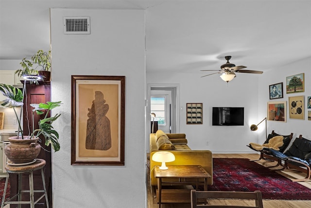 11202 Myrtice Dr, Dallas, TX 75228 - living area featuring wood finished floors, ceiling fan, and baseboards