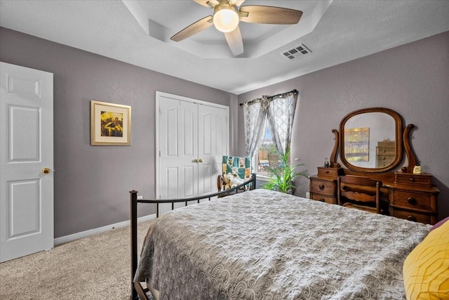 809 Remington Park, Robinson, TX 76706 - bedroom with carpet, a tray ceiling, a closet, ceiling fan, and baseboards