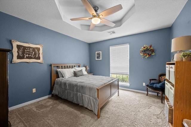 809 Remington Park, Robinson, TX 76706 - carpeted bedroom featuring a raised ceiling, baseboards, a ceiling fan, and a textured ceiling