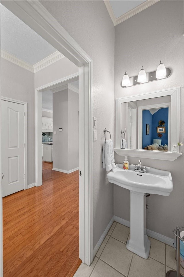 809 Remington Park, Robinson, TX 76706 - bathroom with ornamental molding, baseboards, and tile patterned floors
