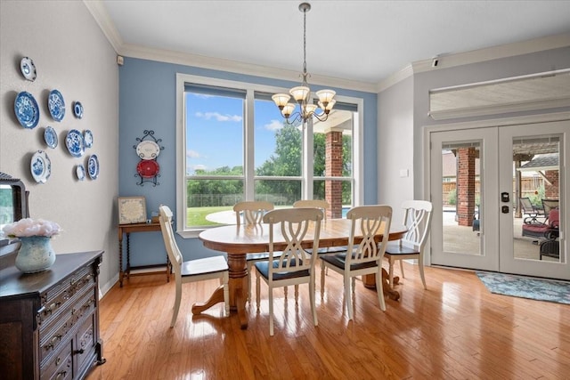 809 Remington Park, Robinson, TX 76706 - dining area with french doors, light wood finished floors, a chandelier, ornamental molding, and baseboards