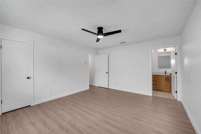 808 Warwick Dr, Plano, TX 75023 - unfurnished bedroom with light wood-type flooring, baseboards, ensuite bath, and a ceiling fan