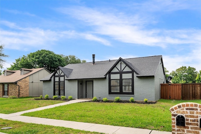 808 Warwick Dr, Plano, TX 75023 - tudor-style house with a shingled roof and brick siding