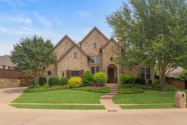2013 Savannah Dr, Mckinney, TX 75072 - tudor house featuring brick siding and stone siding