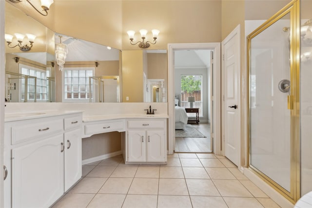 3927 Walden Way, Dallas, TX 75287 - ensuite bathroom with a stall shower, tile patterned floors, vanity, and a chandelier