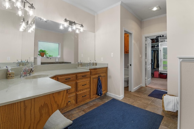 18551 Lazy Ln, Flint, TX 75762 - full bathroom featuring crown molding, healthy amount of natural light, double vanity, toilet, and baseboards