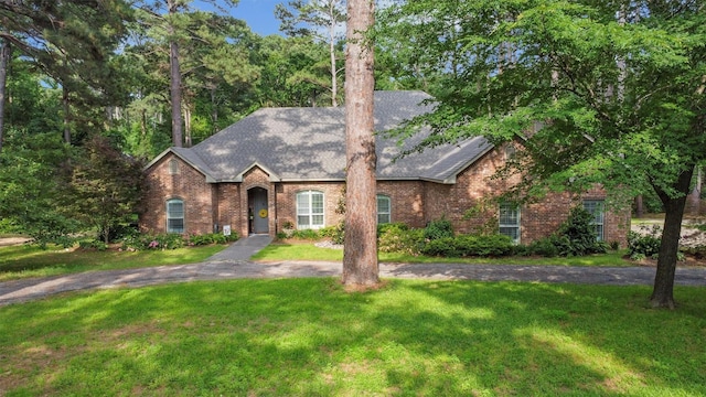 18551 Lazy Ln, Flint, TX 75762 - view of front of house with brick siding, a front yard, and roof with shingles