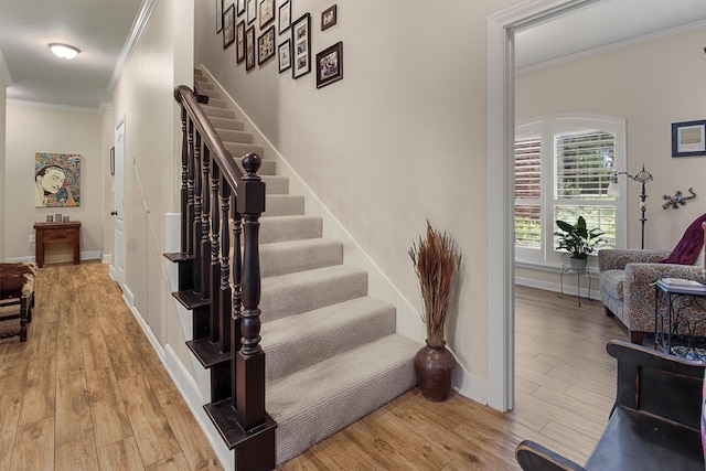 18551 Lazy Ln, Flint, TX 75762 - stairs with crown molding, wood finished floors, baseboards, and arched walkways