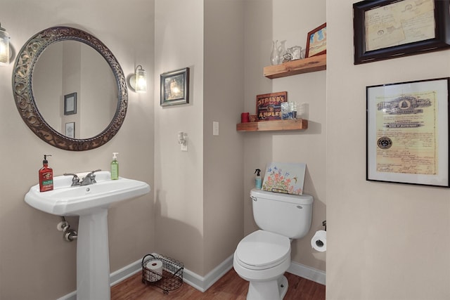 18551 Lazy Ln, Flint, TX 75762 - bathroom featuring wood finished floors, toilet, baseboards, and a sink