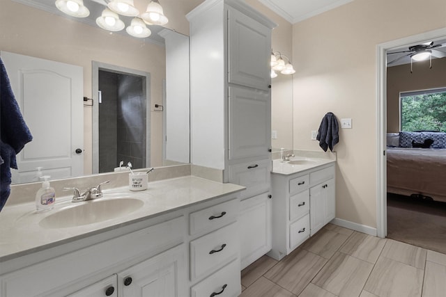 18551 Lazy Ln, Flint, TX 75762 - ensuite bathroom with crown molding, two vanities, baseboards, and a ceiling fan