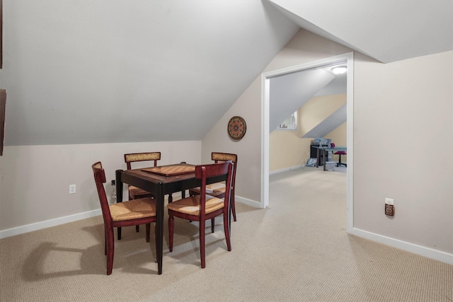 18551 Lazy Ln, Flint, TX 75762 - dining space with light carpet, baseboards, and vaulted ceiling
