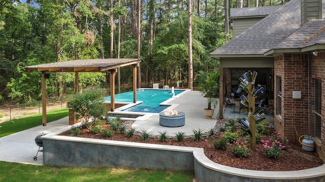 18551 Lazy Ln, Flint, TX 75762 - outdoor pool featuring a fire pit and a patio area