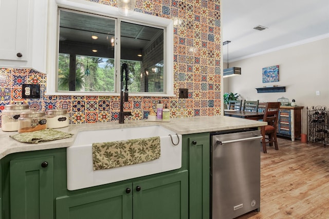 18551 Lazy Ln, Flint, TX 75762 - kitchen with green cabinets, tasteful backsplash, crown molding, a sink, and stainless steel dishwasher