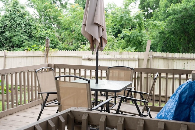 1611 Ave B, Dallas, TX 75203 - wooden terrace featuring outdoor dining area