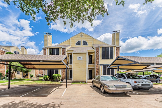 4430 Point Blvd Unit 204, Garland, TX 75043 - view of building exterior with covered and uncovered parking