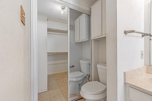 4430 Point Blvd Unit 204, Garland, TX 75043 - bathroom with toilet, tile patterned floors, and vanity