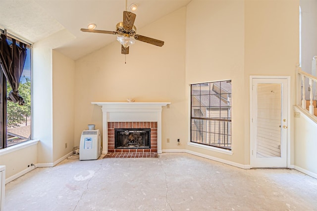 4430 Point Blvd Unit 204, Garland, TX 75043 - unfurnished living room with a brick fireplace, baseboards, a ceiling fan, and high vaulted ceiling