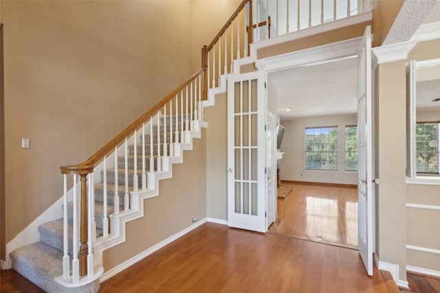 2822 Roundrock, Mckinney, TX 75072 - stairs featuring wood finished floors, baseboards, and french doors