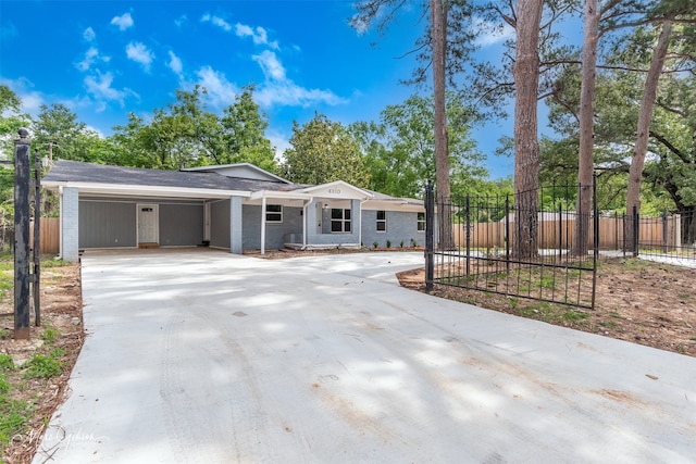 4210 Via St, Shreveport, LA 71109 - ranch-style house featuring driveway, brick siding, and an attached carport