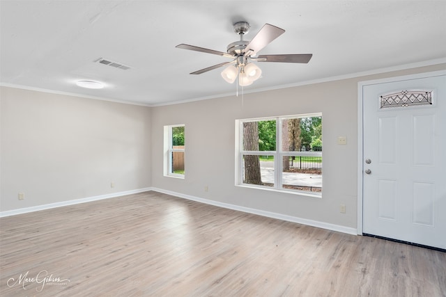 4210 Via St, Shreveport, LA 71109 - empty room featuring healthy amount of natural light, light wood finished floors, baseboards, and crown molding