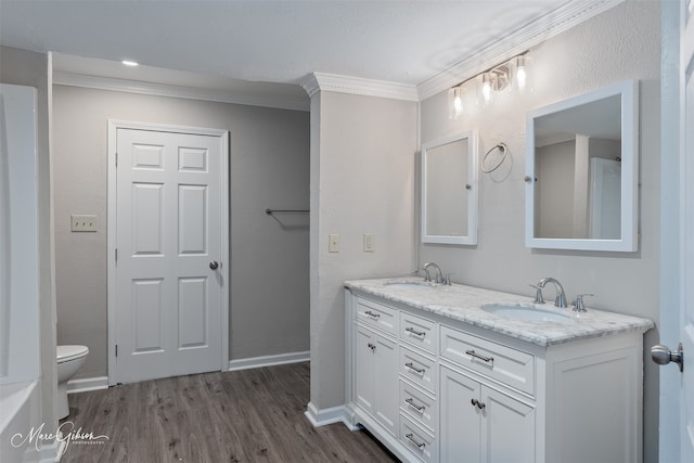 4210 Via St, Shreveport, LA 71109 - full bath featuring ornamental molding, toilet, wood finished floors, double vanity, and baseboards
