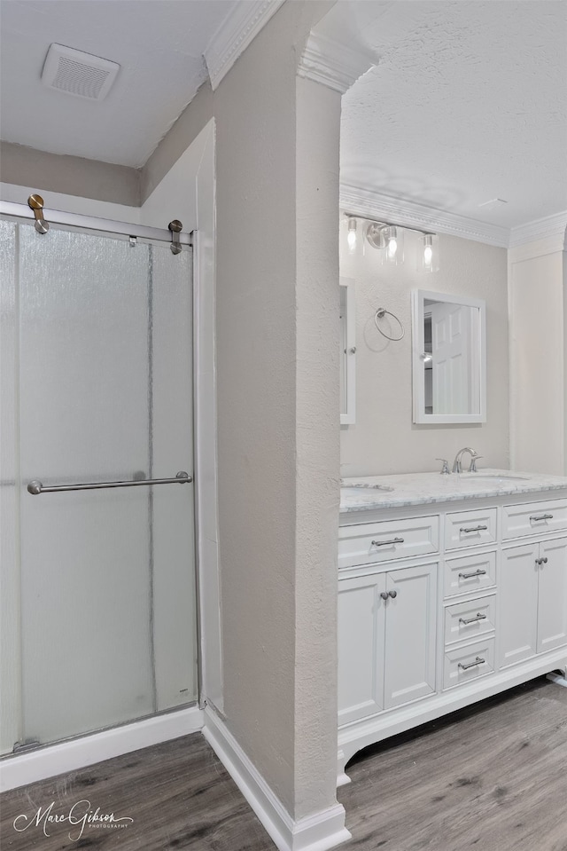 4210 Via St, Shreveport, LA 71109 - full bathroom featuring wood finished floors, a stall shower, vanity, and ornamental molding