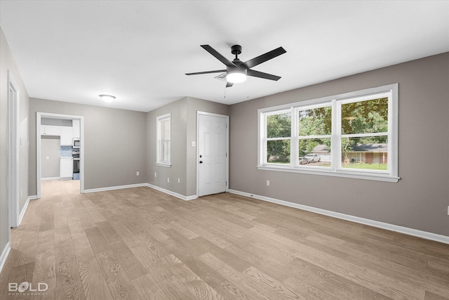 9312 Pine Grove St, Shreveport, LA 71118 - empty room with light wood finished floors, baseboards, and a ceiling fan