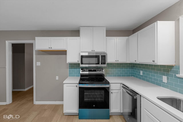 9312 Pine Grove St, Shreveport, LA 71118 - kitchen featuring appliances with stainless steel finishes, light wood-type flooring, and light countertops