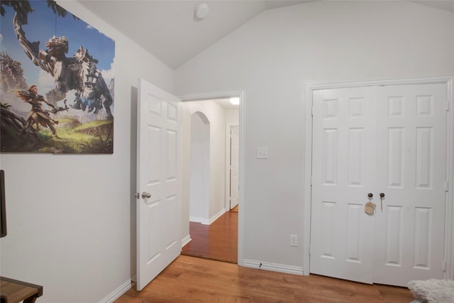 1212 Live Oak St, Royse City, TX 75189 - unfurnished bedroom featuring vaulted ceiling, wood finished floors, arched walkways, a closet, and baseboards