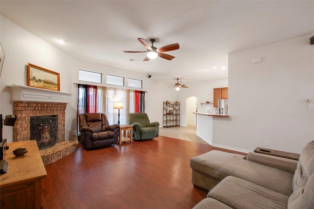 1212 Live Oak St, Royse City, TX 75189 - living area with ceiling fan, a fireplace, light wood finished floors, recessed lighting, and baseboards