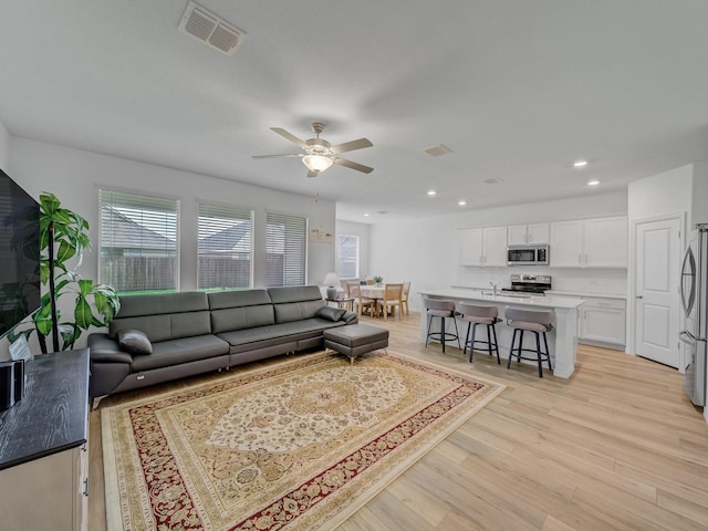 316 Crossvine Way, Princeton, TX 75407 - living room featuring light wood-type flooring, a ceiling fan, and recessed lighting