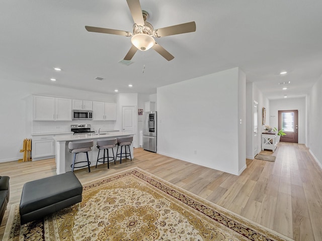 316 Crossvine Way, Princeton, TX 75407 - living area with light wood-style flooring, baseboards, recessed lighting, and ceiling fan