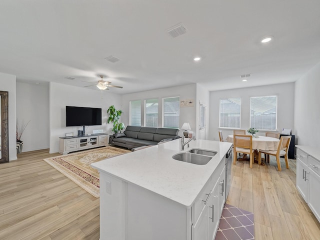 316 Crossvine Way, Princeton, TX 75407 - kitchen with a sink, light wood-type flooring, dishwasher, white cabinets, and ceiling fan