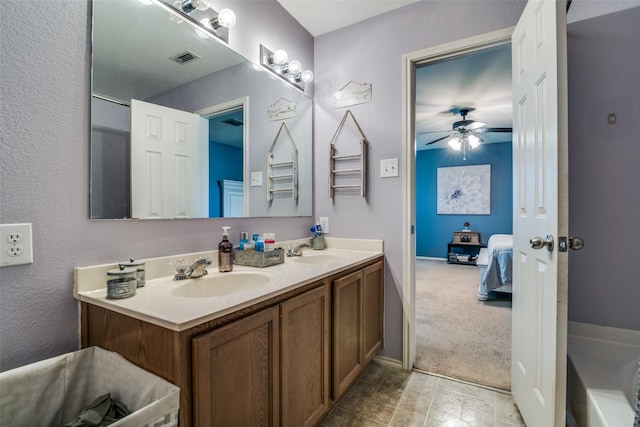 1224 Evergreen St, Royse City, TX 75189 - bathroom with ensuite bathroom, a ceiling fan, double vanity, and a tub to relax in