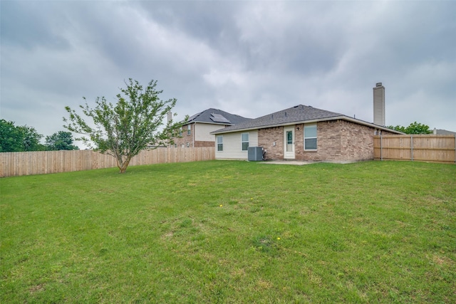 1224 Evergreen St, Royse City, TX 75189 - back of property featuring a chimney, central air condition unit, and brick siding