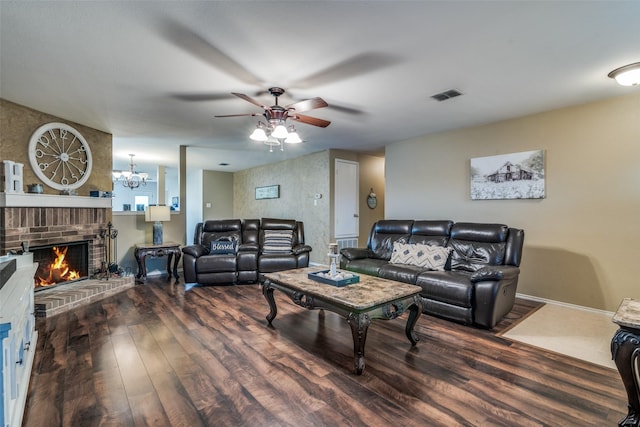 1224 Evergreen St, Royse City, TX 75189 - living room with wood finished floors, a ceiling fan, a fireplace, and a chandelier