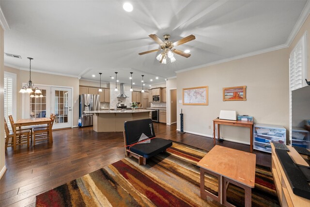 9205 Yellow Stone Rd, Waco, TX 76712 - living area with dark wood-style floors, ornamental molding, recessed lighting, a ceiling fan, and a chandelier