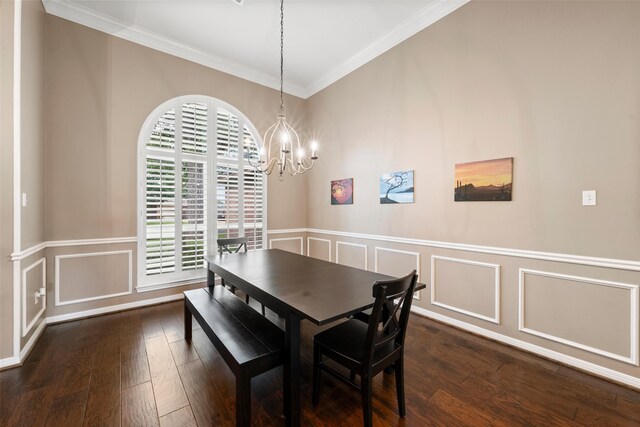 9205 Yellow Stone Rd, Waco, TX 76712 - dining room with ornamental molding, a chandelier, a decorative wall, dark wood-style flooring, and wainscoting