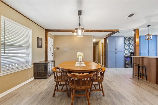1004 Fairway Ln, Mexia, TX 76667 - dining area featuring light wood-style floors, baseboards, and decorative columns
