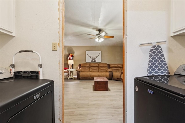 1004 Fairway Ln, Mexia, TX 76667 - kitchen featuring independent washer and dryer, a ceiling fan, white cabinetry, and light wood finished floors