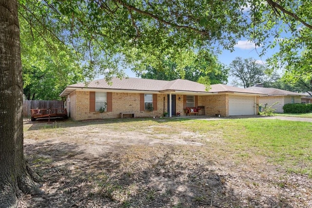1004 Fairway Ln, Mexia, TX 76667 - ranch-style house featuring brick siding, a garage, and driveway
