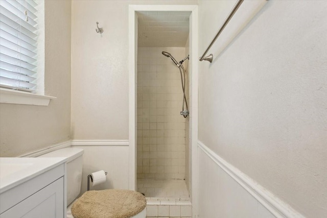 1004 Fairway Ln, Mexia, TX 76667 - full bath with a stall shower, a wainscoted wall, vanity, and toilet