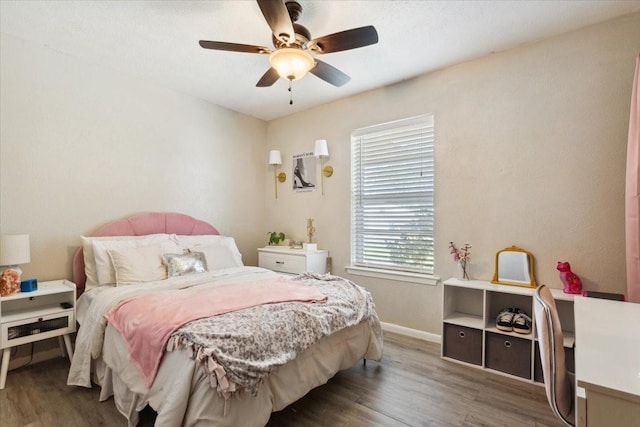 1004 Fairway Ln, Mexia, TX 76667 - bedroom with wood finished floors, baseboards, and ceiling fan