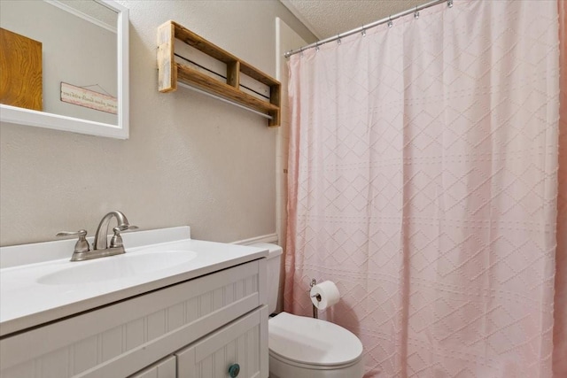 1004 Fairway Ln, Mexia, TX 76667 - bathroom with toilet, a textured ceiling, vanity, and a shower with curtain