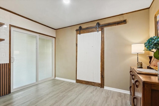 1004 Fairway Ln, Mexia, TX 76667 - bedroom with wood finished floors, baseboards, crown molding, and a barn door