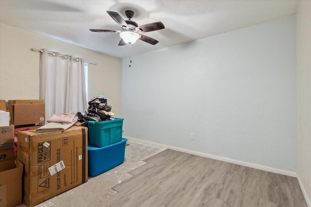 1004 Fairway Ln, Mexia, TX 76667 - bedroom with wood finished floors, ceiling fan, and baseboards