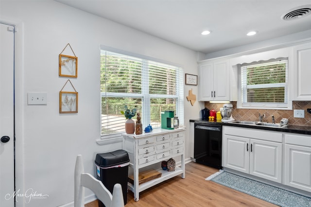 2147 Pine Hill Rd, Shreveport, LA 71107 - kitchen featuring black dishwasher, white cabinetry, light wood finished floors, tasteful backsplash, and recessed lighting