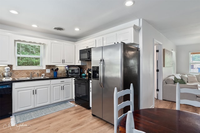 2147 Pine Hill Rd, Shreveport, LA 71107 - kitchen featuring black appliances, a sink, white cabinets, dark countertops, and decorative backsplash