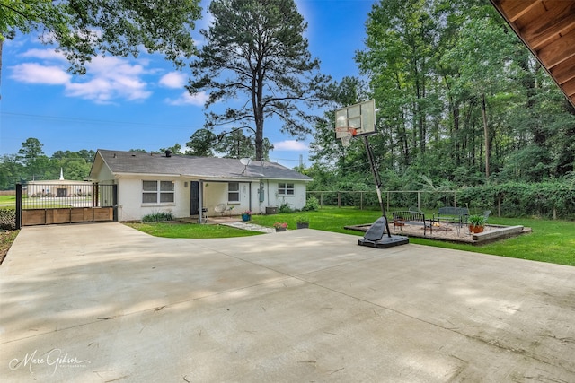 2147 Pine Hill Rd, Shreveport, LA 71107 - exterior space with a gate, concrete driveway, and stucco siding